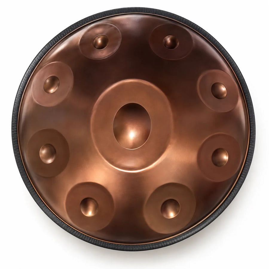 Handpan D Kurd bronze 9 notes en inox vu de dessus : une note centrale et 8 notes autour