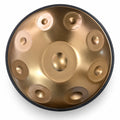 Handpan D Kurd doré 9 notes en inox vu de dessus : une note centrale et 8 notes autour