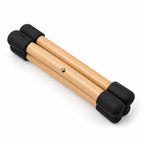Mini support pour handpan replié : ses trois bâtons en bois rassemblés
